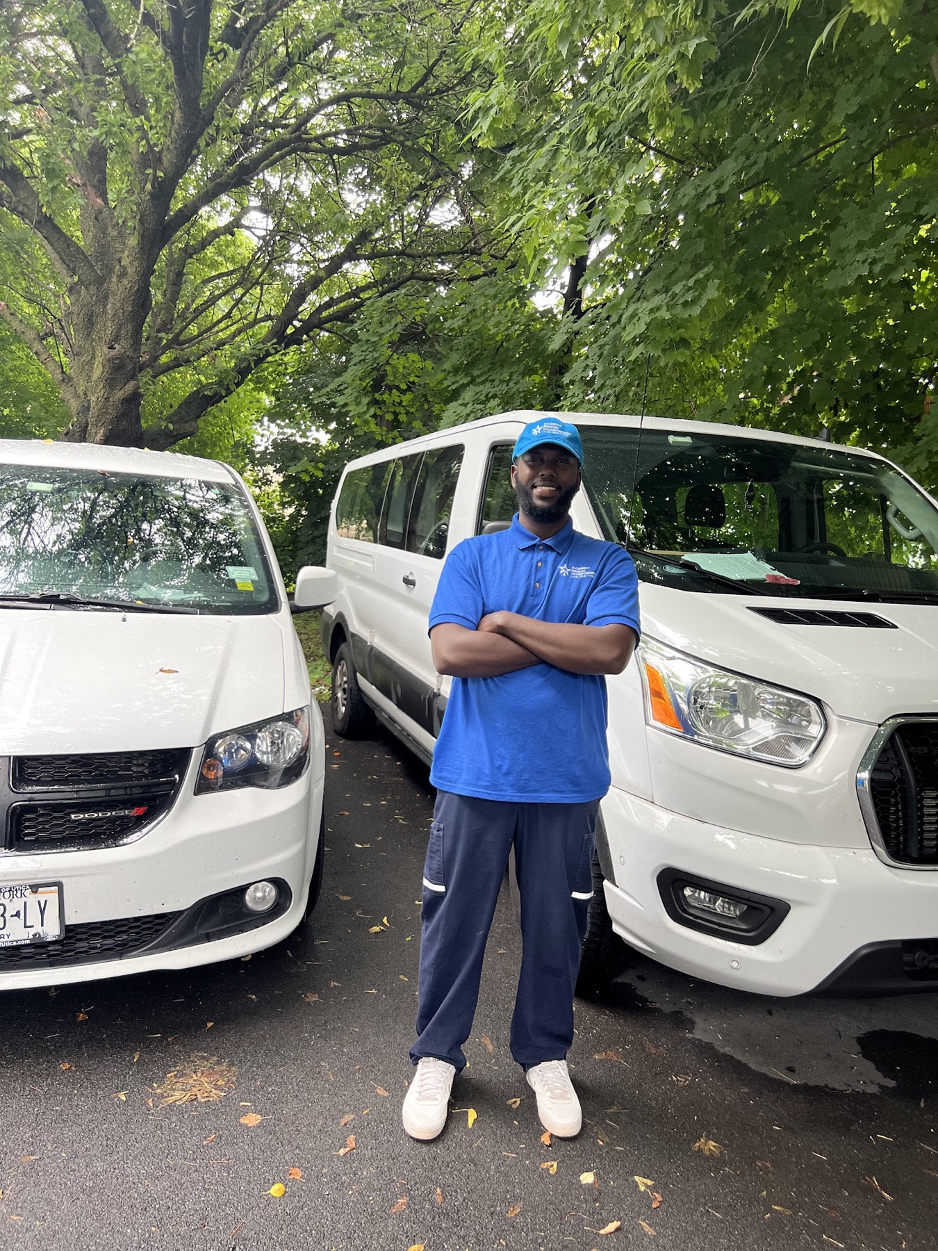 U-Connect driver standing with the transportation fleet